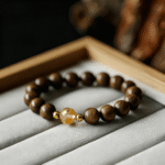 Wooden Bead Bracelet with Gold - Tone Accents and Amber - Like Bead
