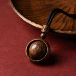 Wooden Spinning Sphere Pendant Necklace with Engraved Bead