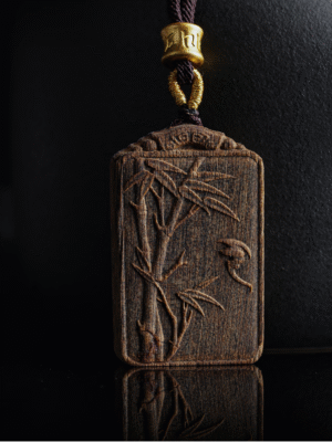 Bamboo symbolizes peace, carved in agarwood.