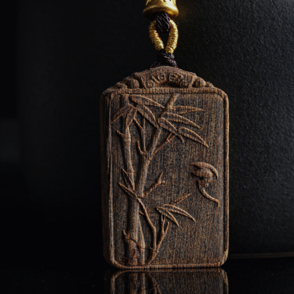 Bamboo symbolizes peace, carved in agarwood.