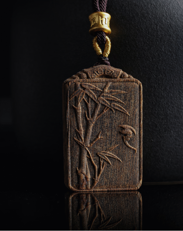Bamboo symbolizes peace, carved in agarwood.