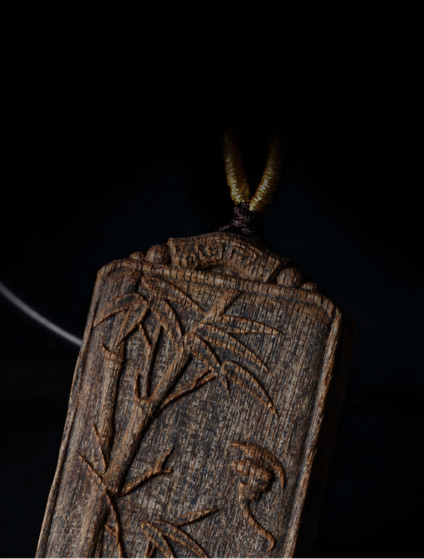 Bamboo symbolizes peace, carved in agarwood.