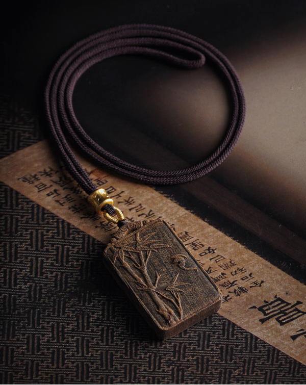 Bamboo symbolizes peace, carved in agarwood.