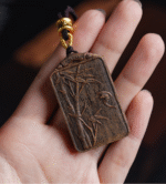 Bamboo symbolizes peace, carved in agarwood.