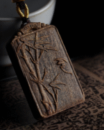 Bamboo symbolizes peace, carved in agarwood.