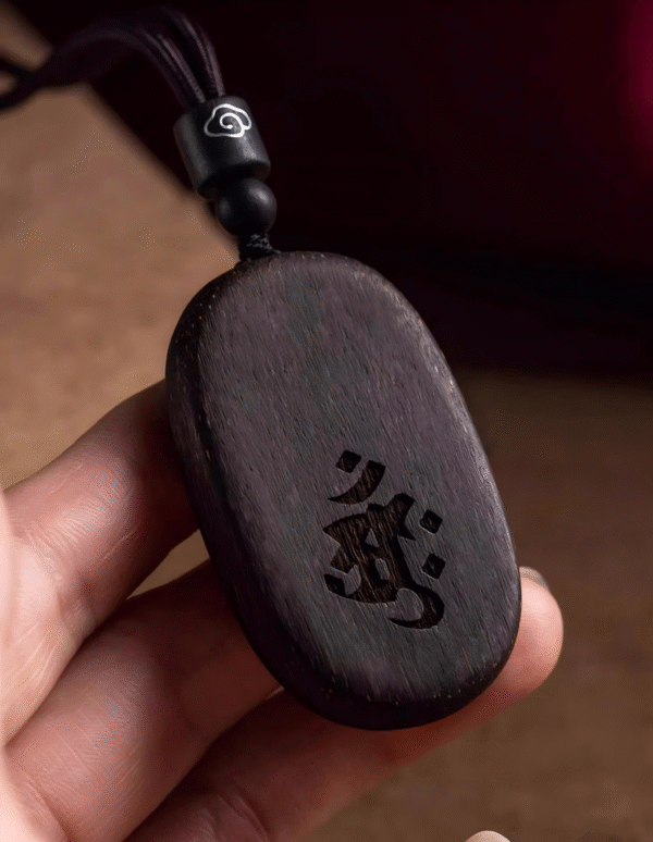 Agarwood Mupai pendant with Chinese zodiac sign.