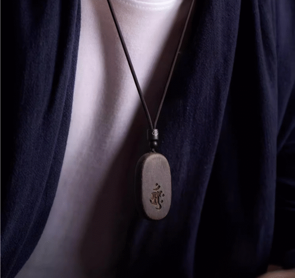 Agarwood Mupai pendant with Chinese zodiac sign.