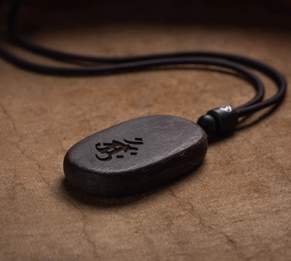 Agarwood Mupai pendant with Chinese zodiac sign.