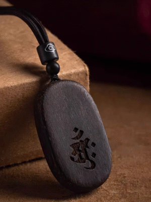 Agarwood Mupai pendant with Chinese zodiac sign.